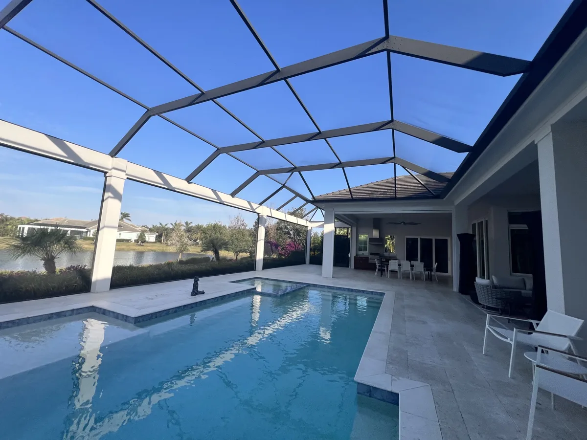 After: freshly painted white columns, beams and lanai walls around the pool under the screen enclosure