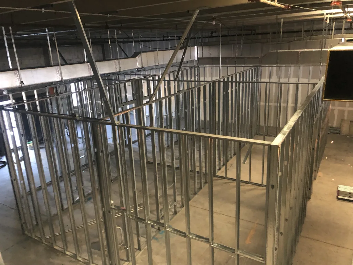 Framing: metal stud walls laying out new offices inside the warehouse