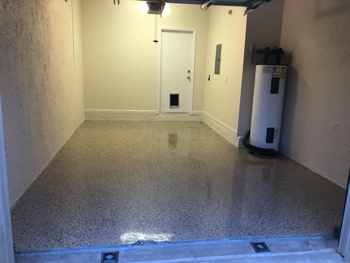 After: freshly painted garage walls with a glossy full-flake floor coating