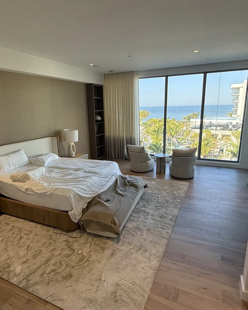 After: finished primary bedroom with fresh paint and Gulf views