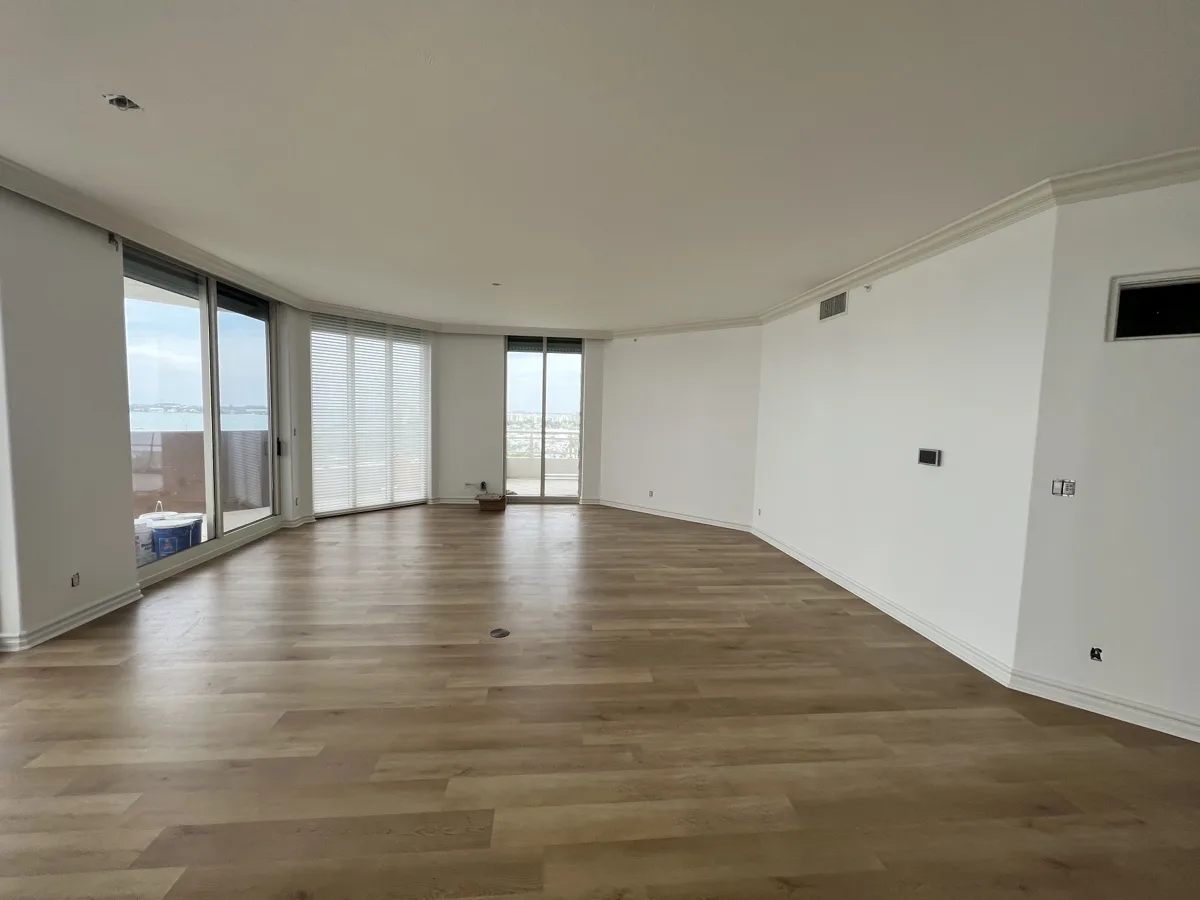 After: smooth level 5 walls and ceilings freshly painted white in a bayfront condo with water views